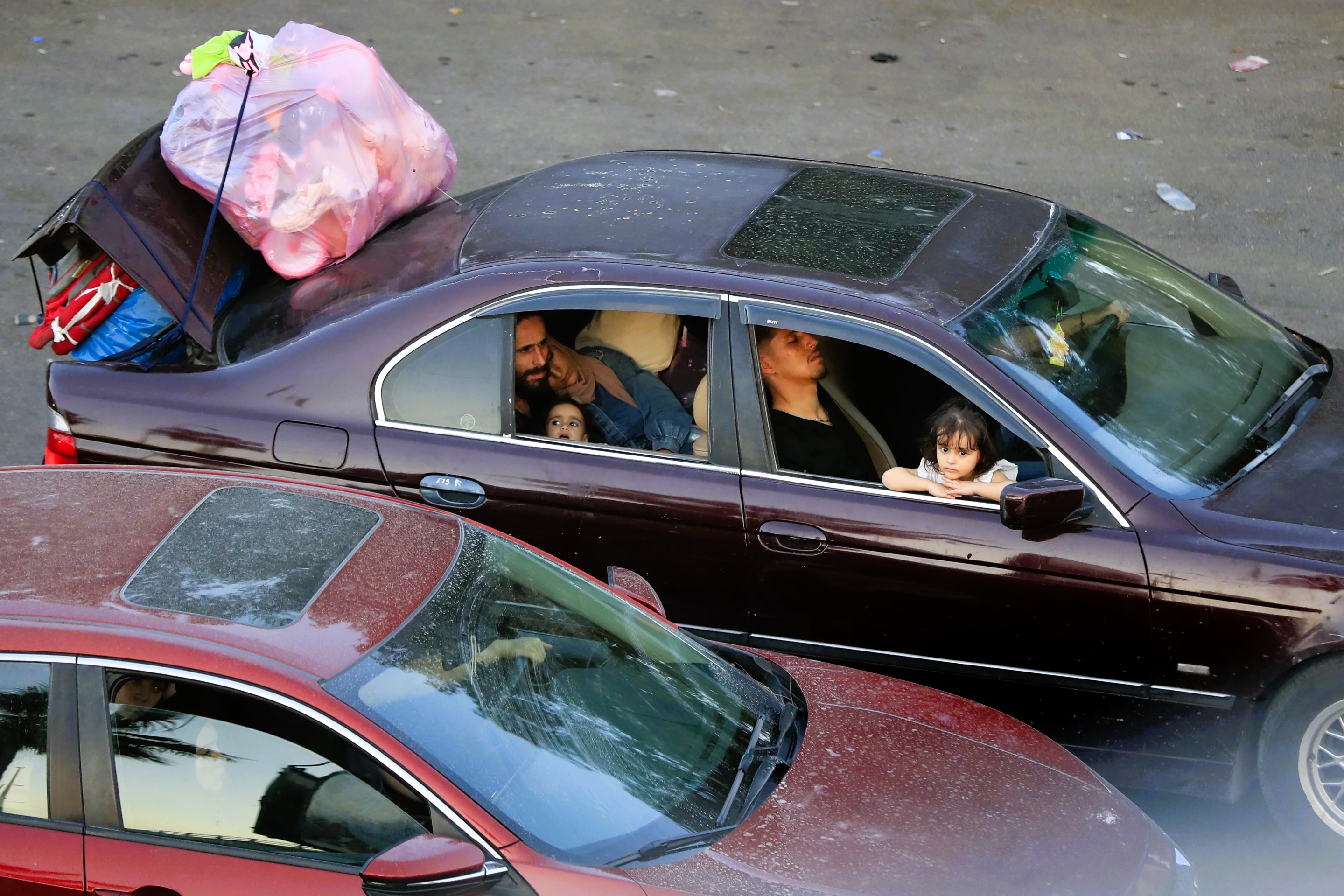 Families from south Lebanon loaded cars, vans and trucks with belongings and people, sometimes multiple generations in one vehicle.